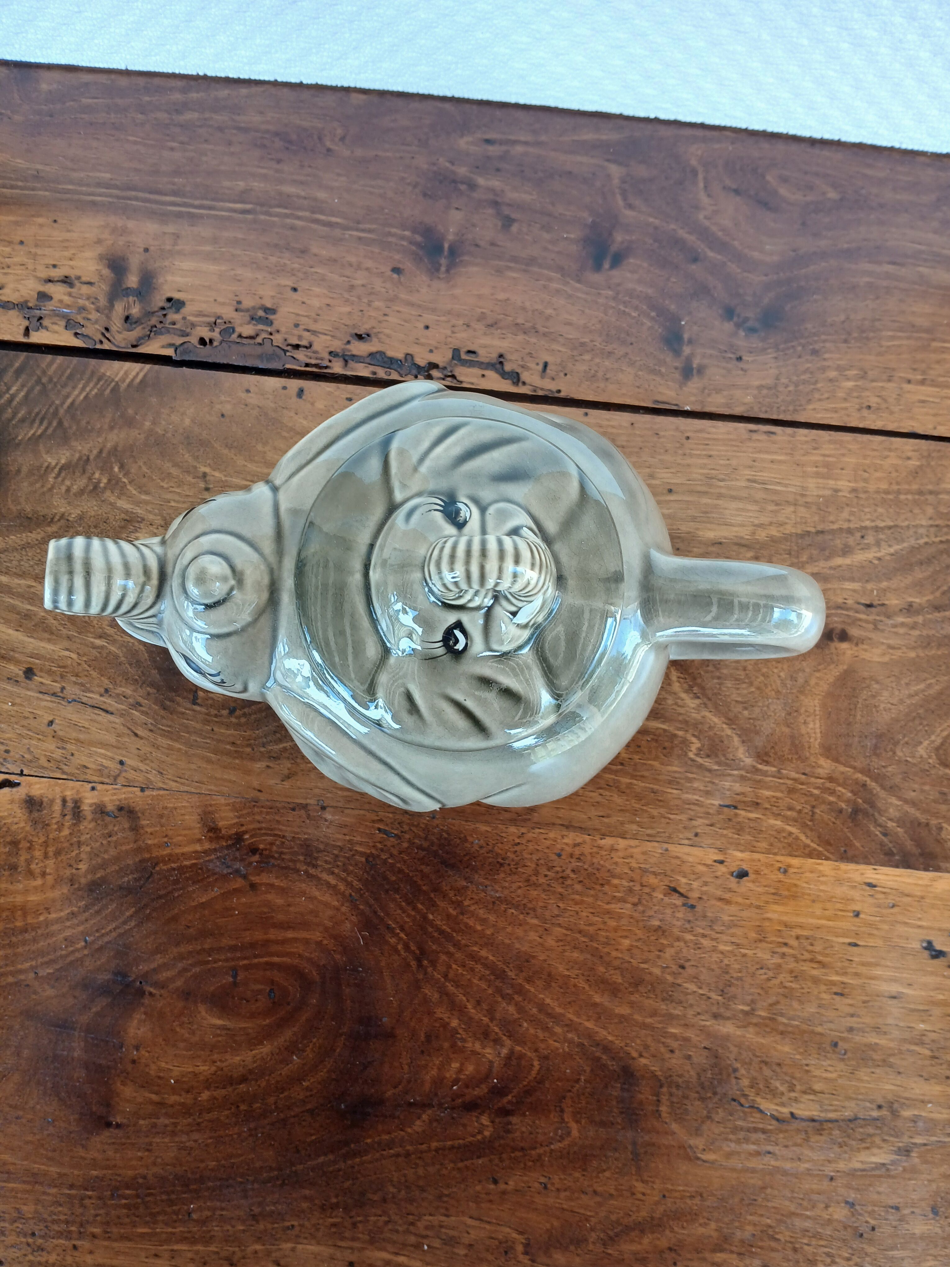 vintage ceramic teapot in the shape of a grey elephant
