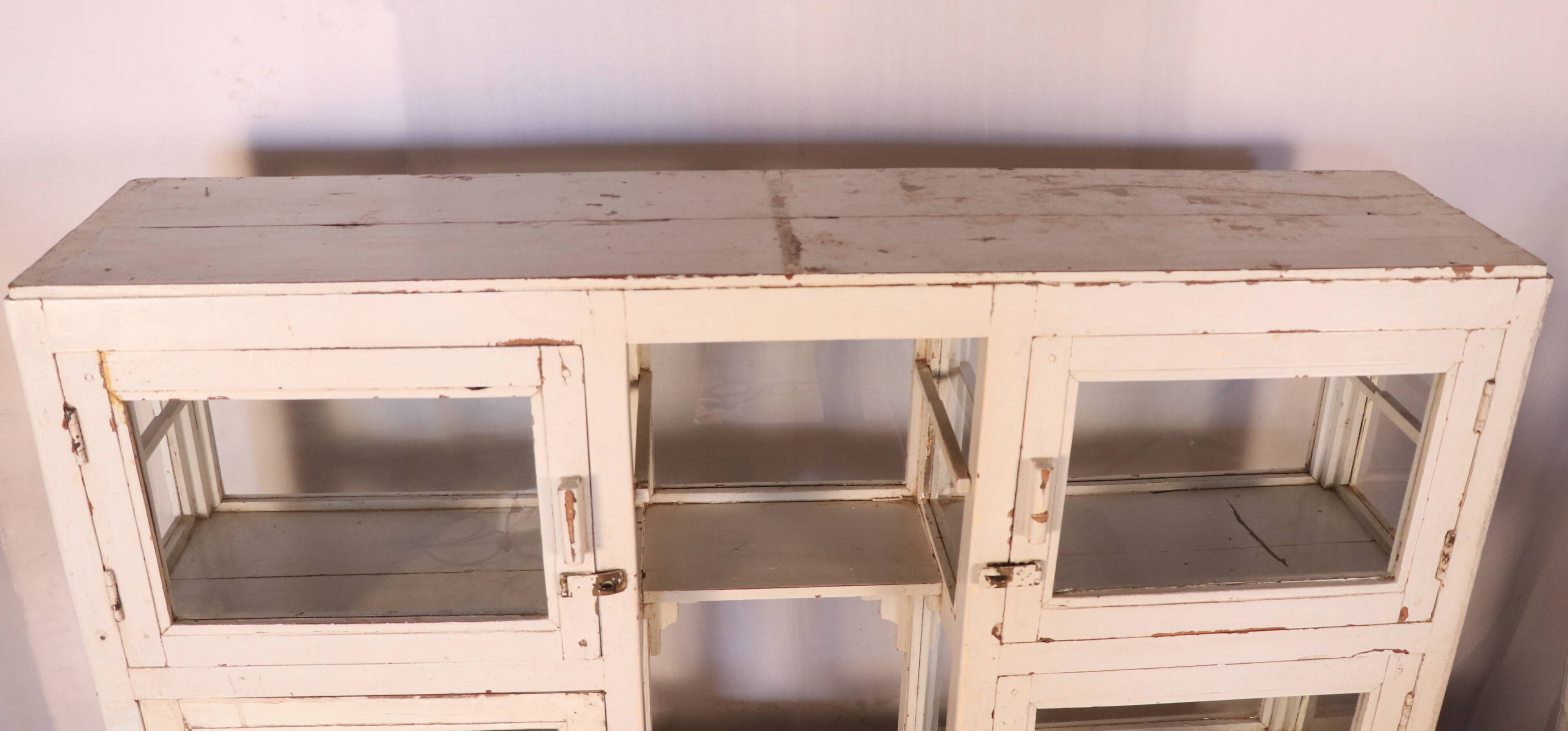 Merchant counter in Burmese teak with original white patina