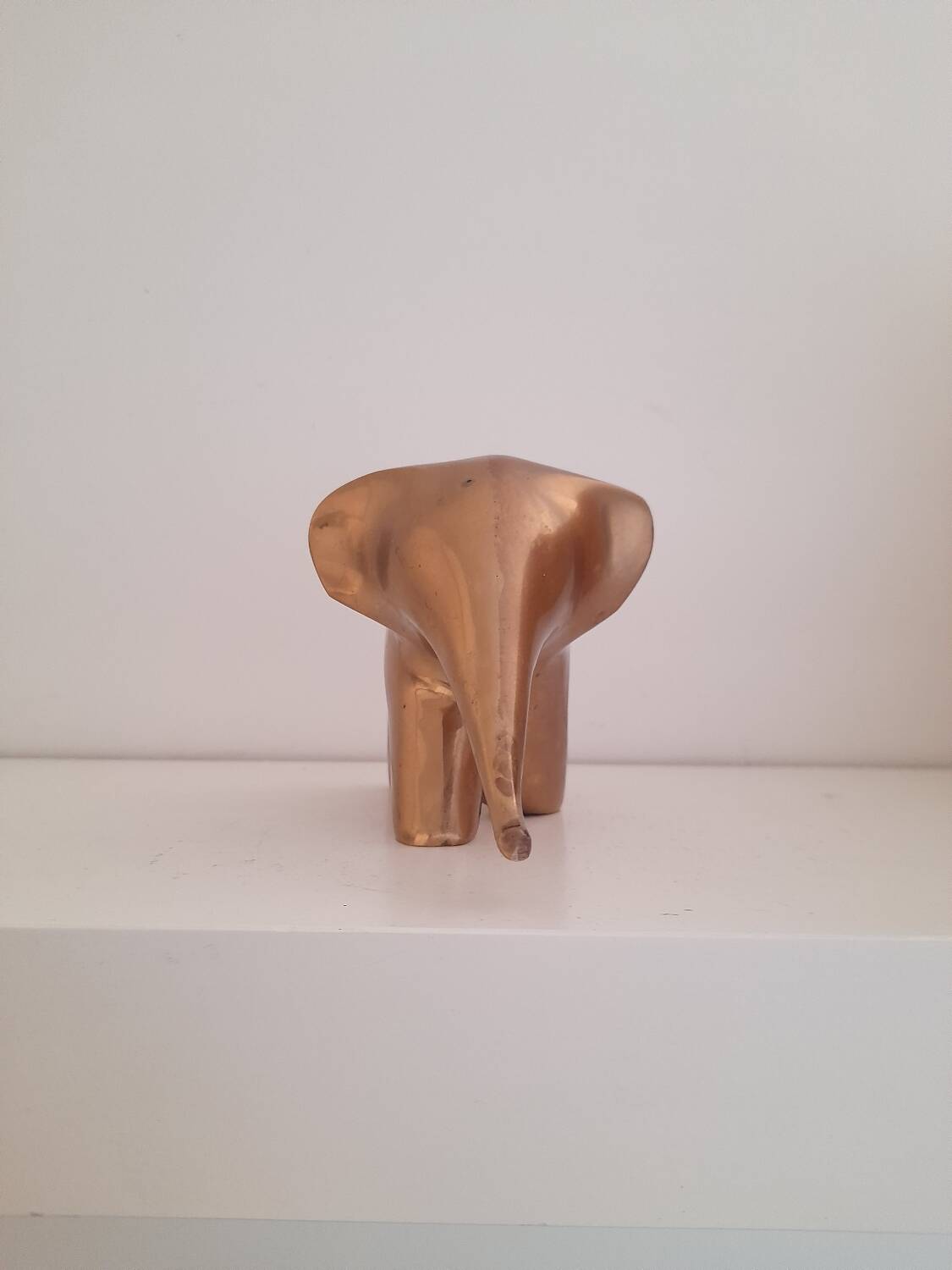 Stylized brass elephant paperweight