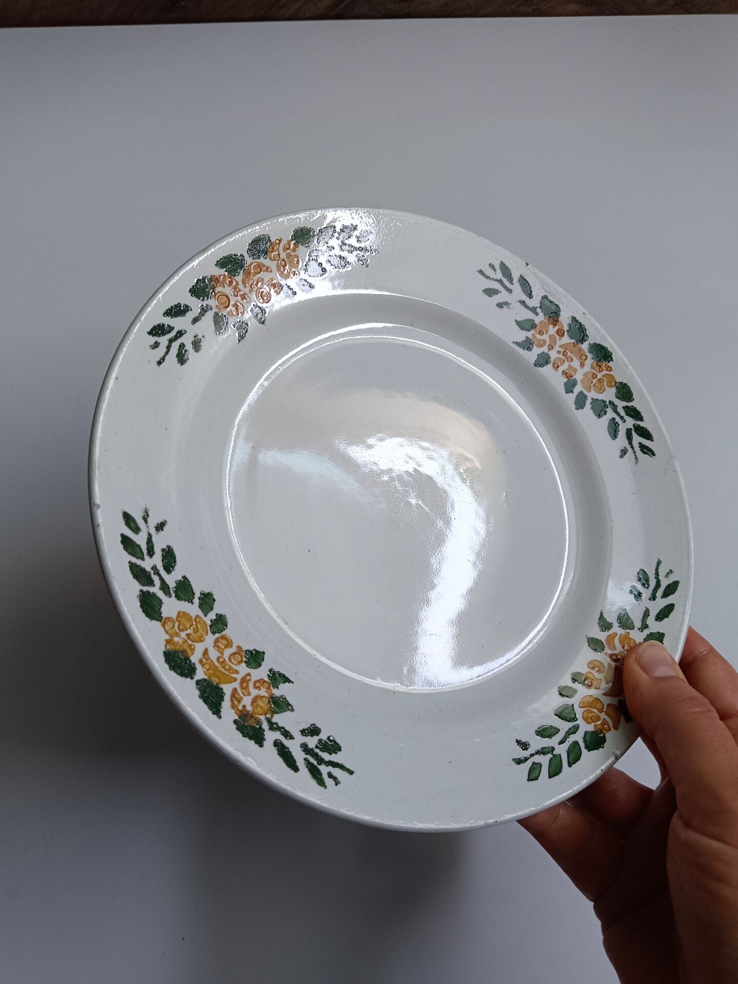 Old round footed plate signed Labrut brothers flowers