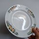 Old round footed plate signed Labrut brothers flowers