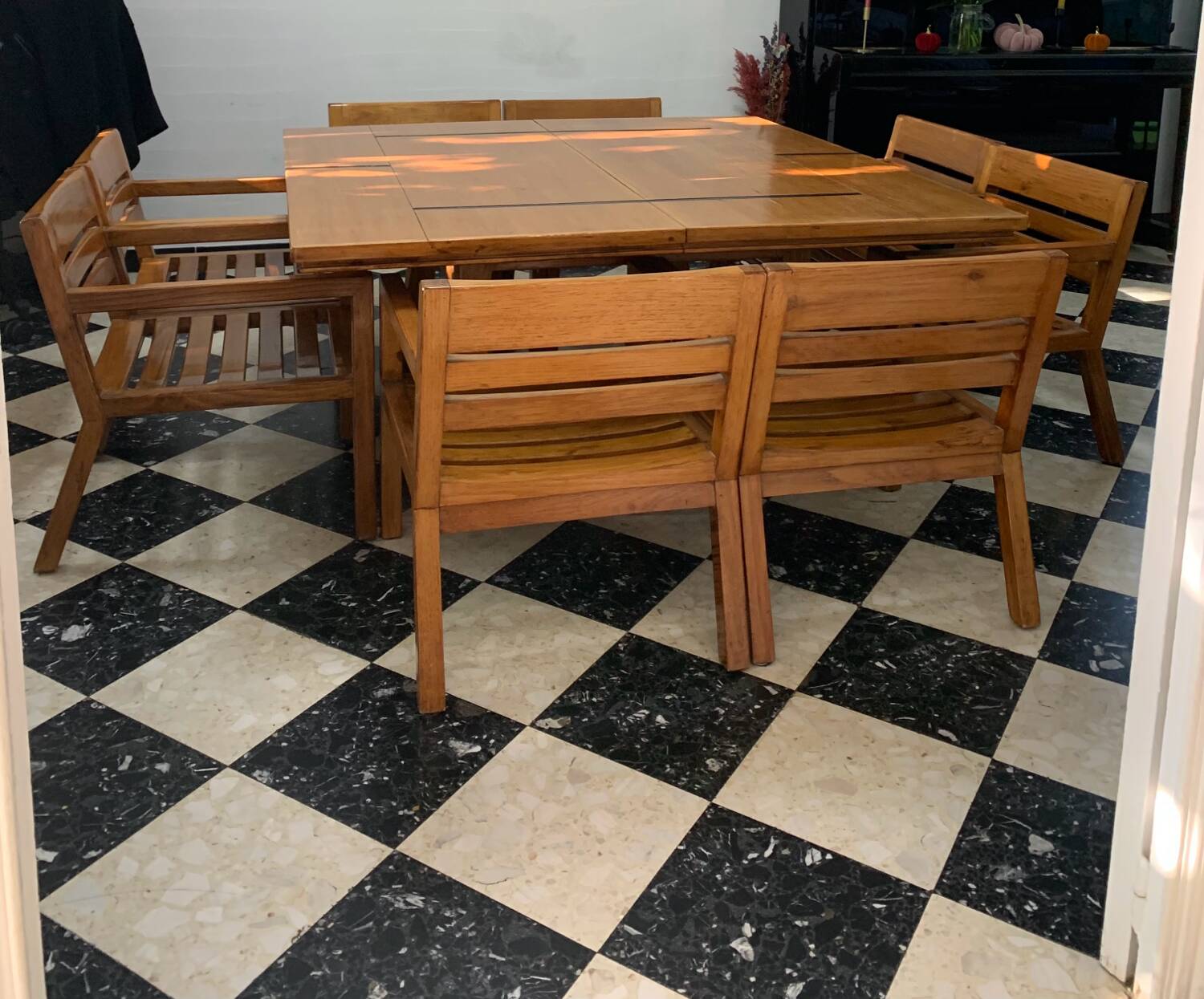 Table and 8 indoor chairs, colonial house, 1990.