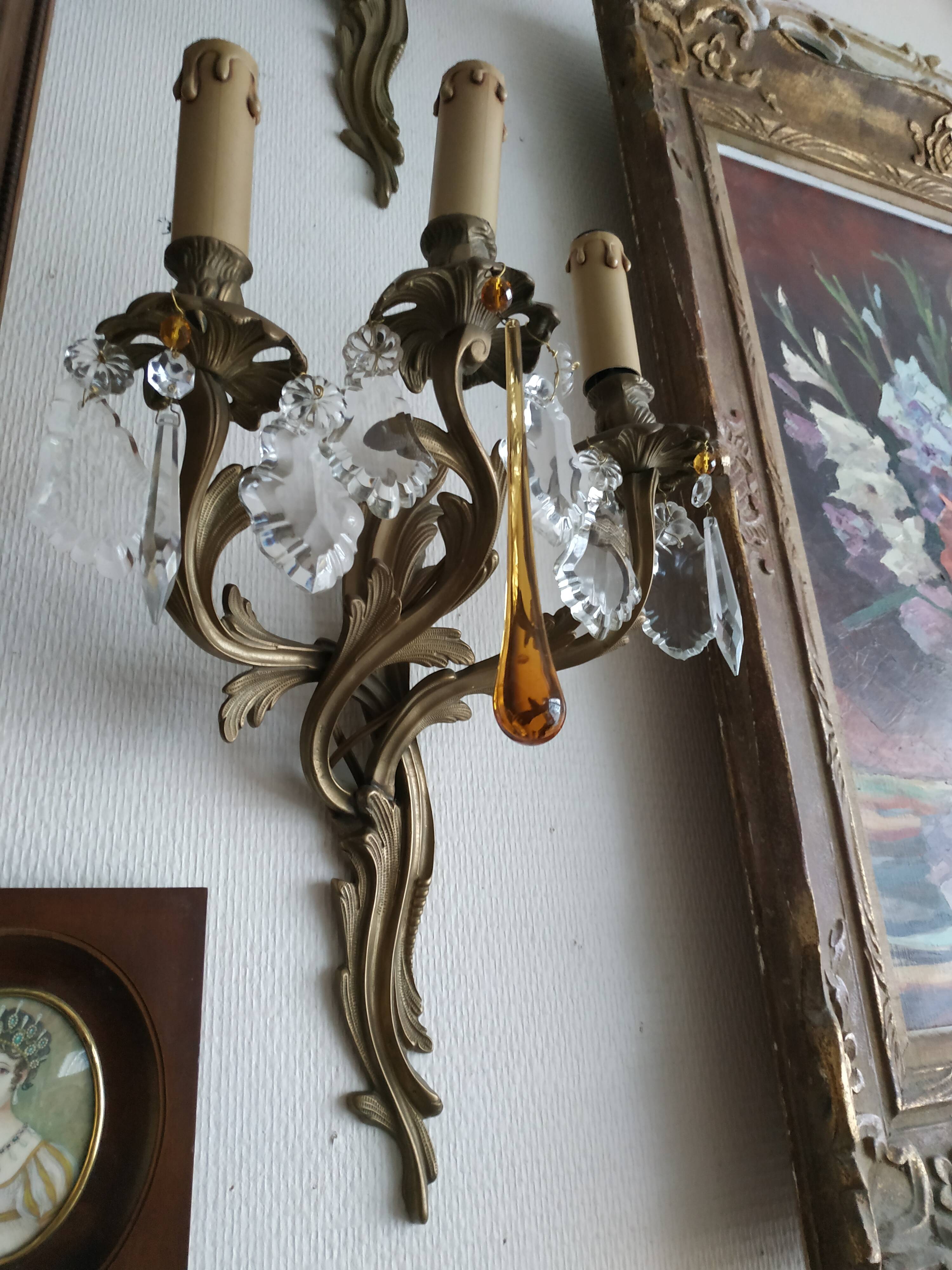 Pair of bronze and crystal sconces