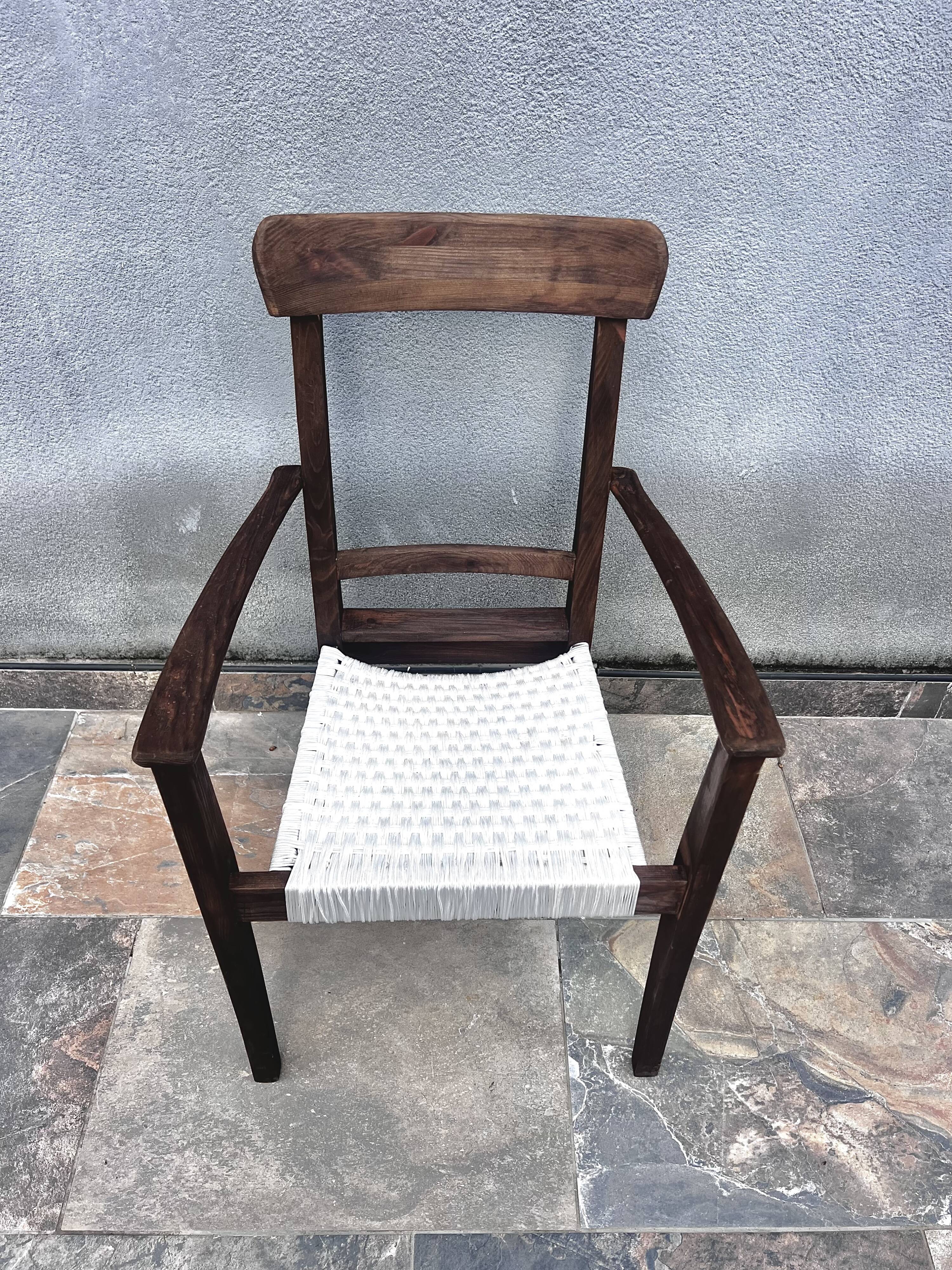 Scandinavian chair in wood and woven natural fibre.