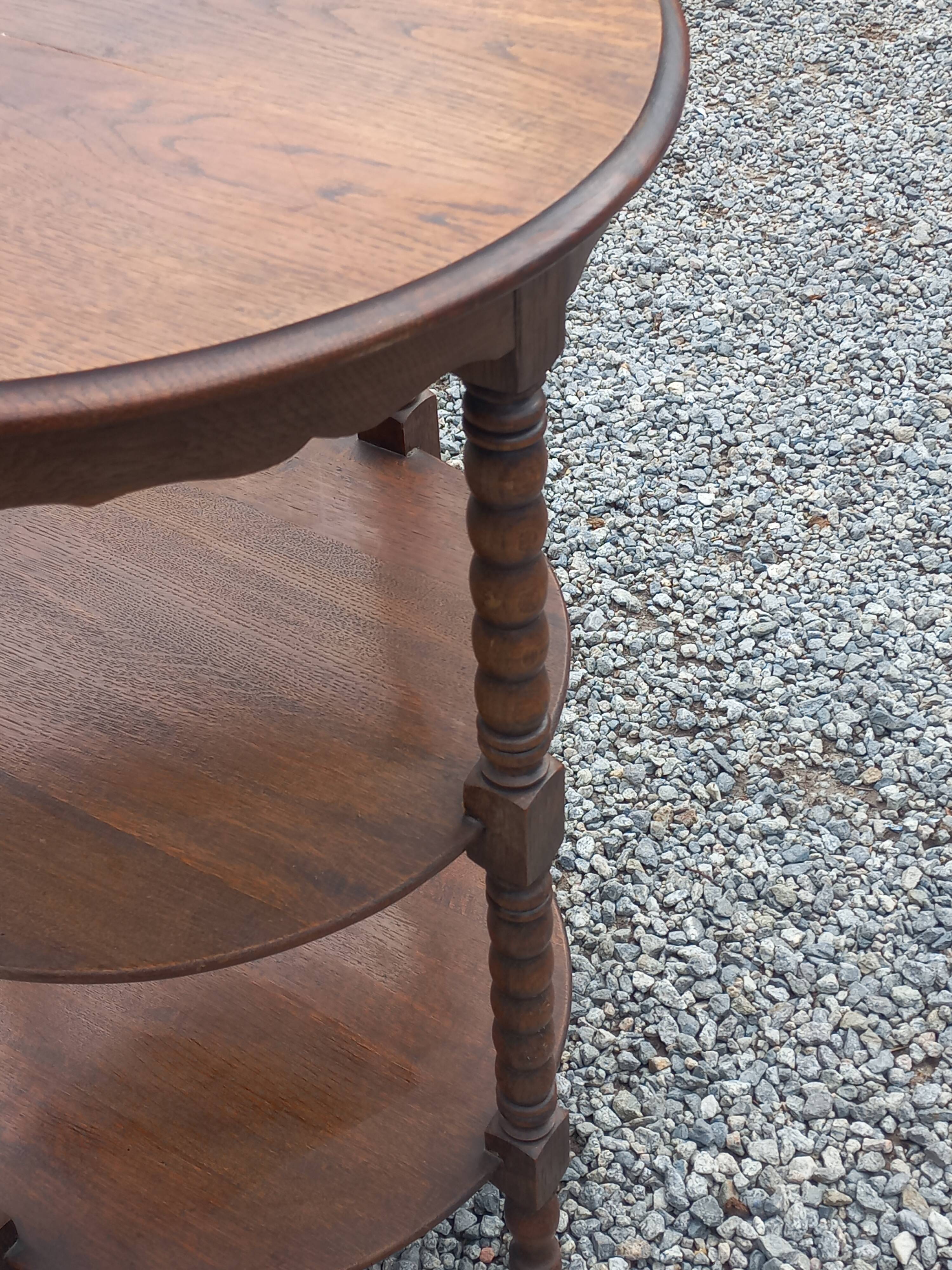 Vintage oak pedestal table with 3 shelves from the 60s