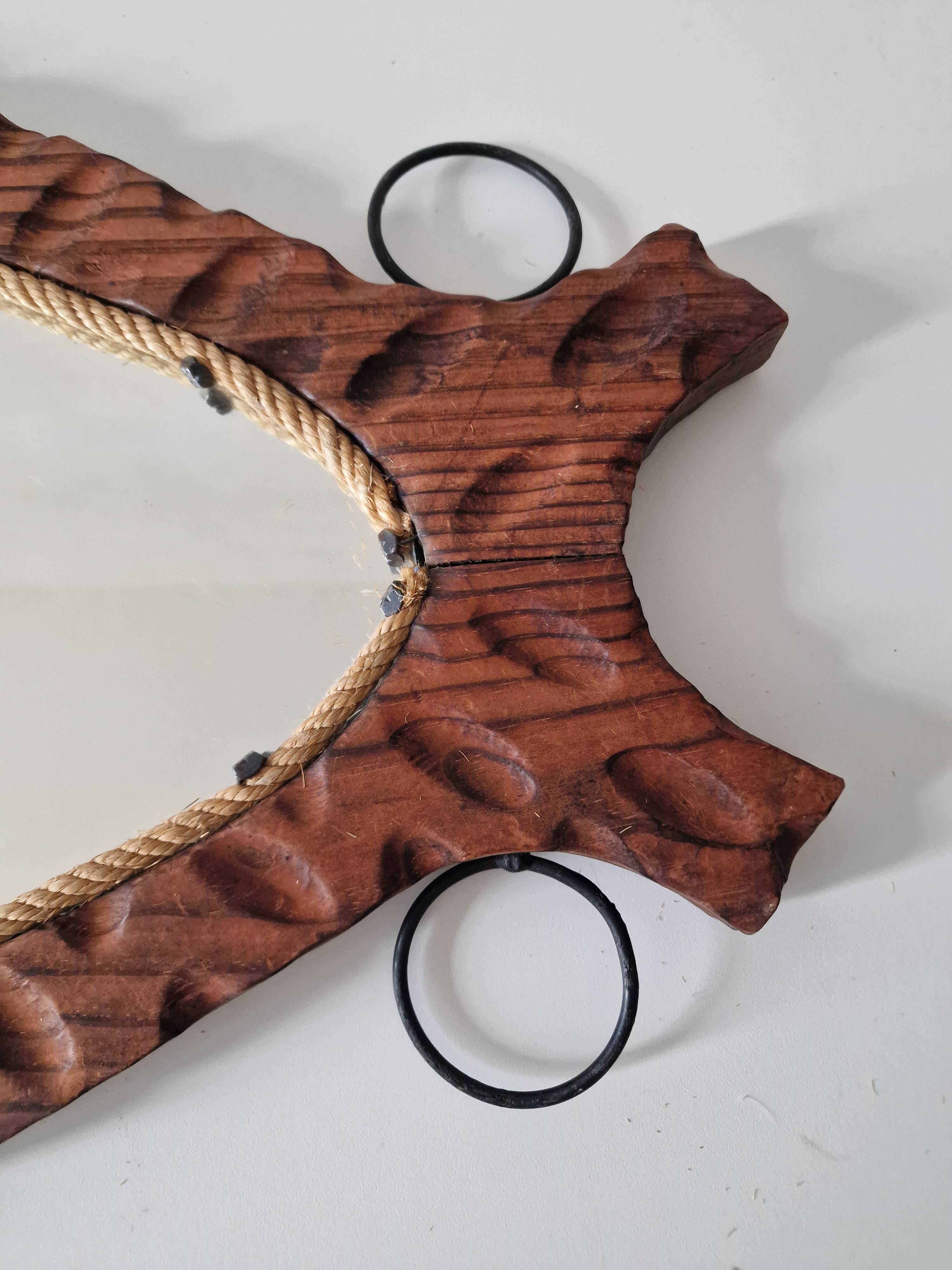 Brutalist mirror in wood and rope, free form.