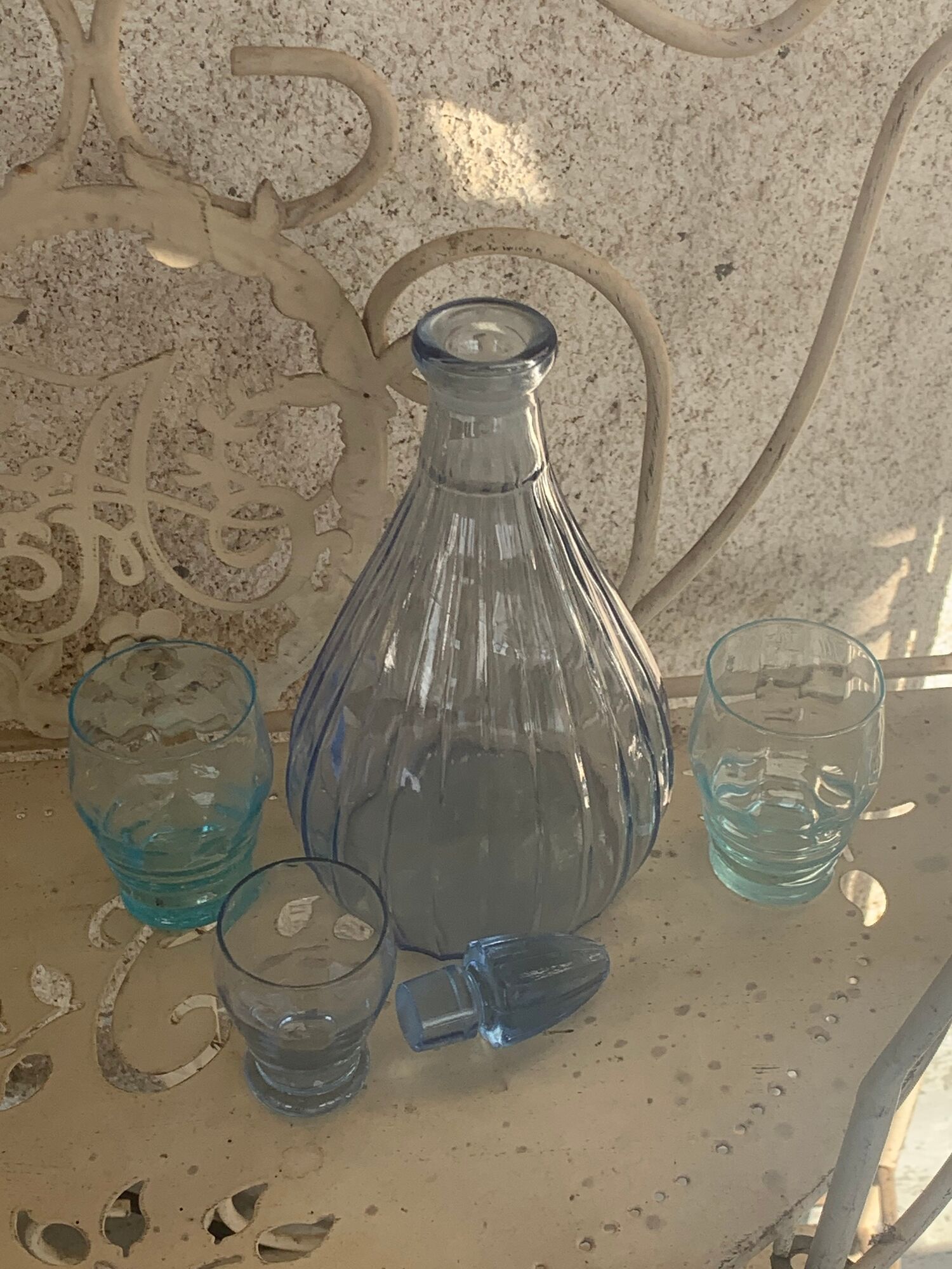 Liquor service consisting of a blue glass decanter and. 3 small antique glasses