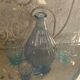 Liquor service consisting of a blue glass decanter and. 3 small antique glasses
