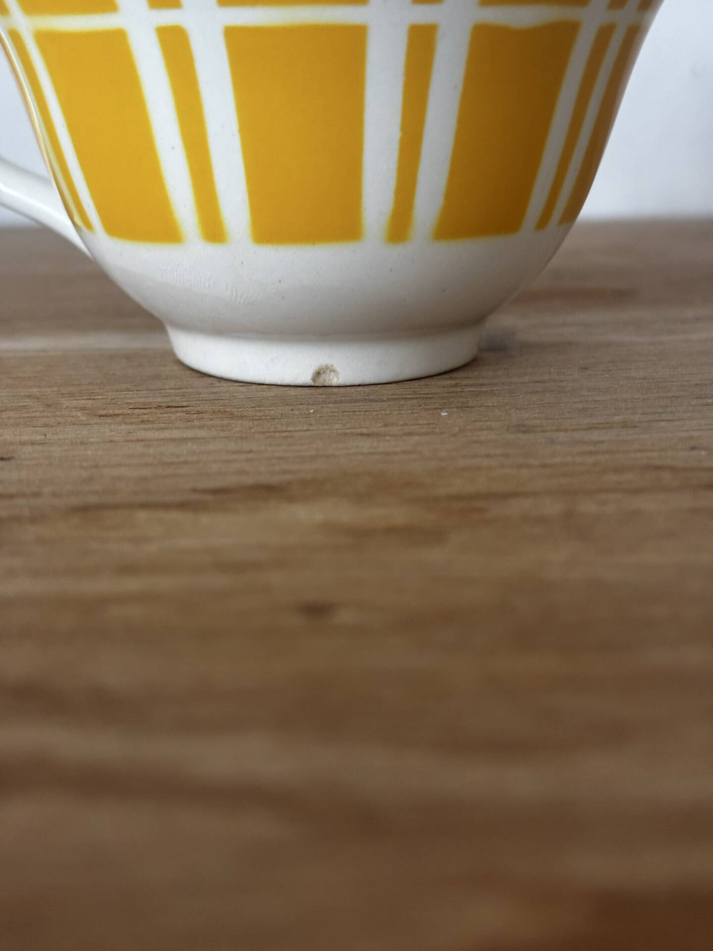 Set of two antique yellow Digoin Sarreguemines cups.