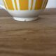 Set of two antique yellow Digoin Sarreguemines cups.