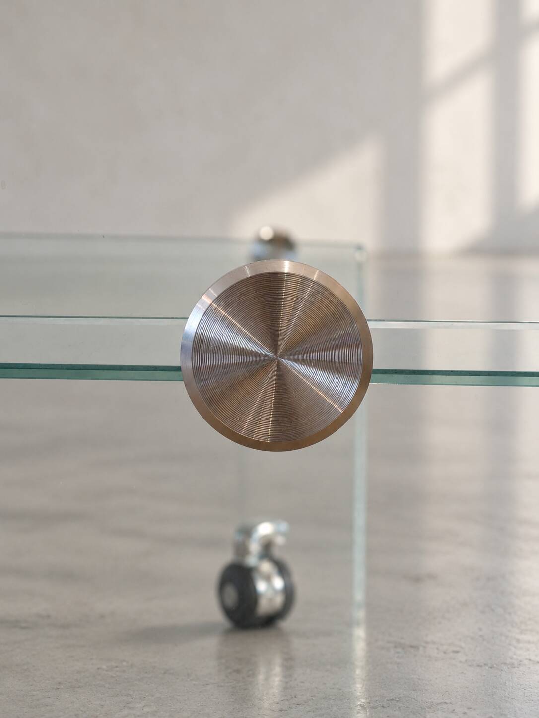 Glass coffee table on wheels