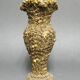 Vase covered with shells. Seaside souvenir.