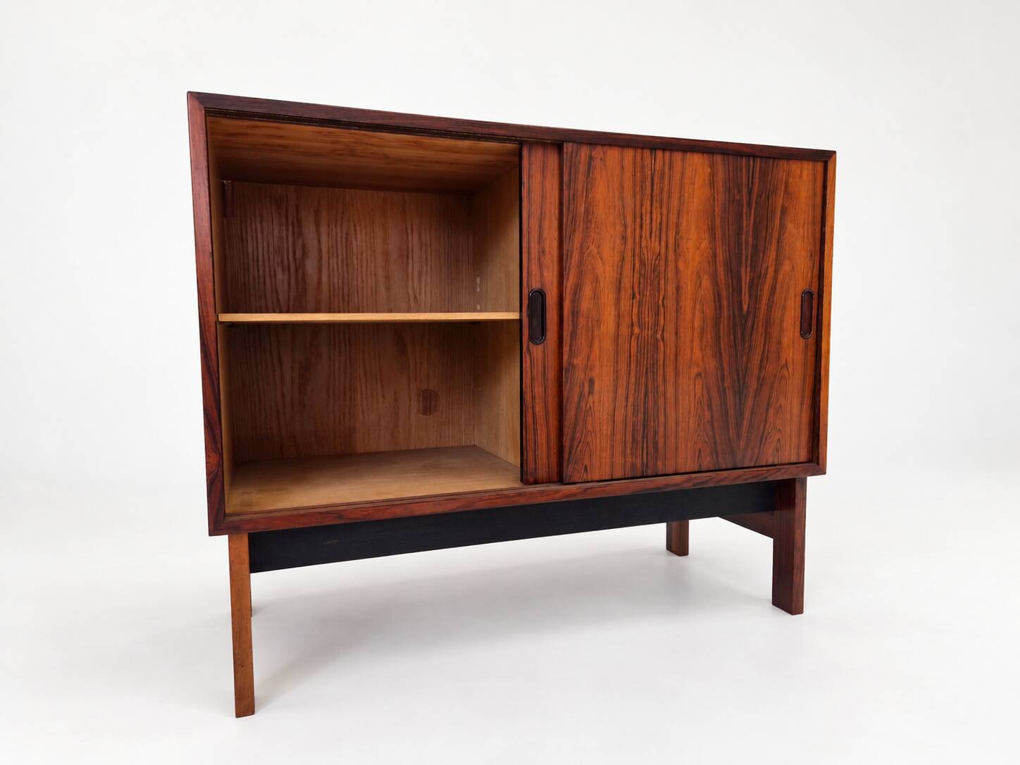 Low sideboard in rosewood with sliding doors. Denmark, 1960s