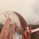 Champagne glass in pink glass with floral engraving