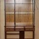 Vintage walnut burr buffet with glass and lighting, Art Deco style.