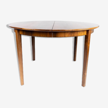 Dining table in rosewood with three extension plates, of danish design from the 1960s.