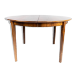Dining table in rosewood with three extension plates, of danish design from the 1960s.