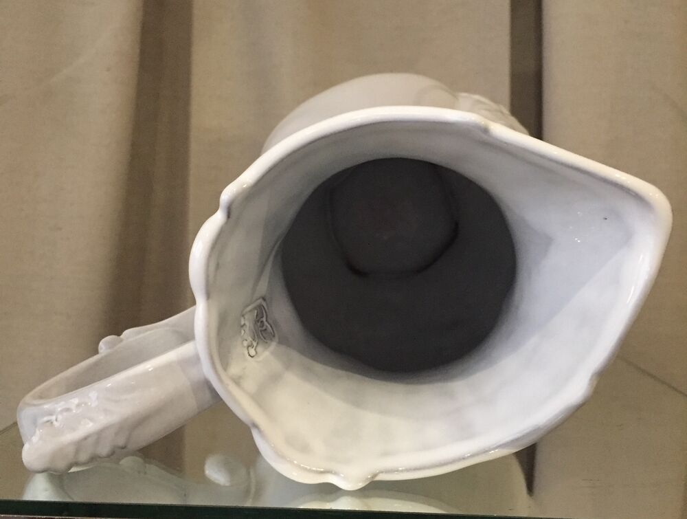 Pitcher has beautiful model beyerle niderviller black earth enamelled with white