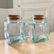 Pair of square jars in tinted glass and corks