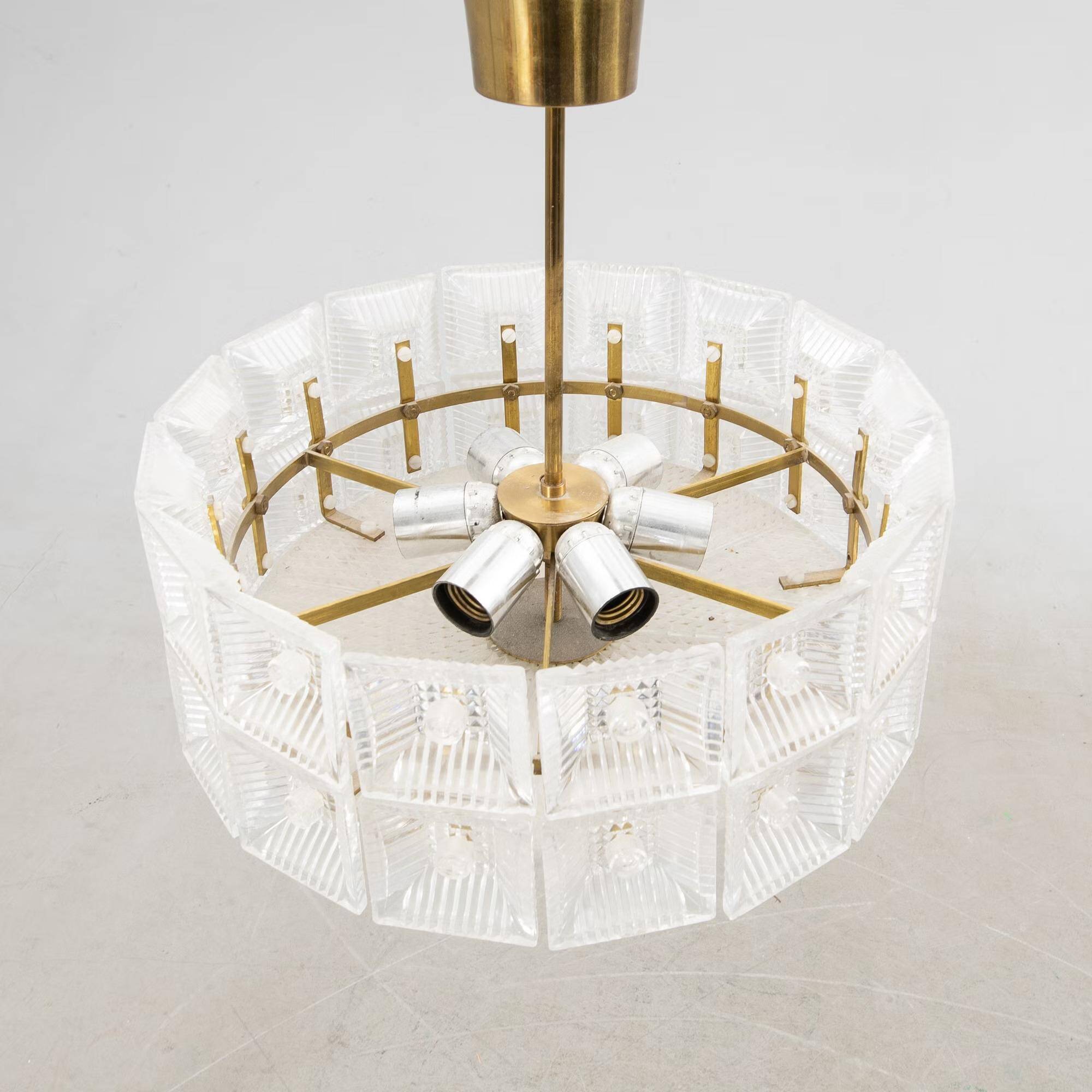 Suspended glass and brass lamp by Carl Fagerlund for Orrefors, Sweden, 1960.