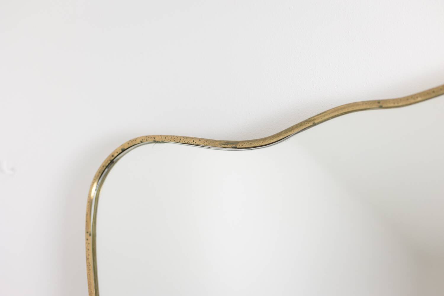 Mirror with a gilded brass frame. 1980s.
