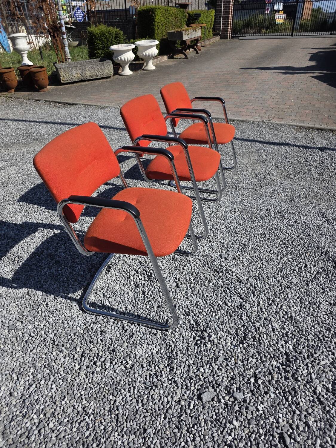 3 vintage chrome metal armchairs with orange fabric tops
