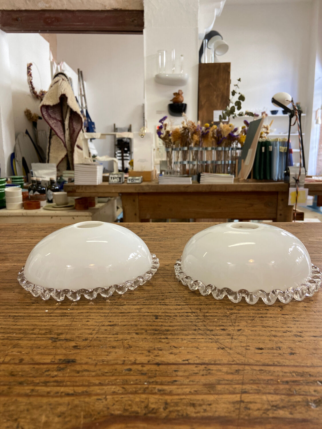 Pair of white glass pendant lights