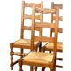 Set of 6 solid wood chairs with straw seats.