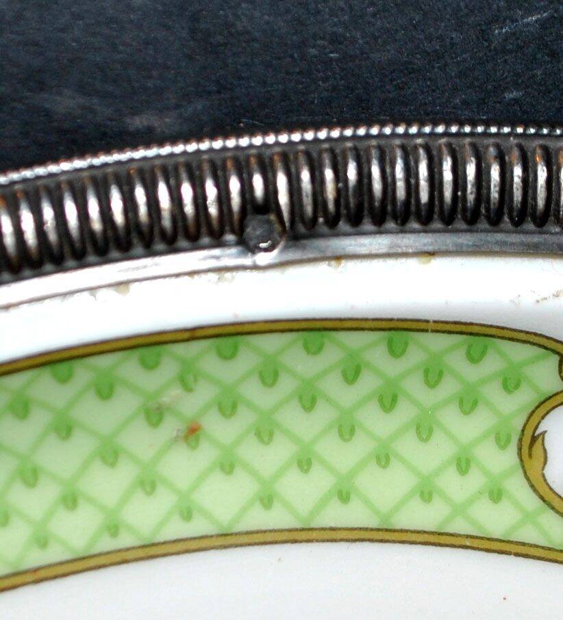 Haviland pie dish in Limoges porcelain with a Minerva silver rim.