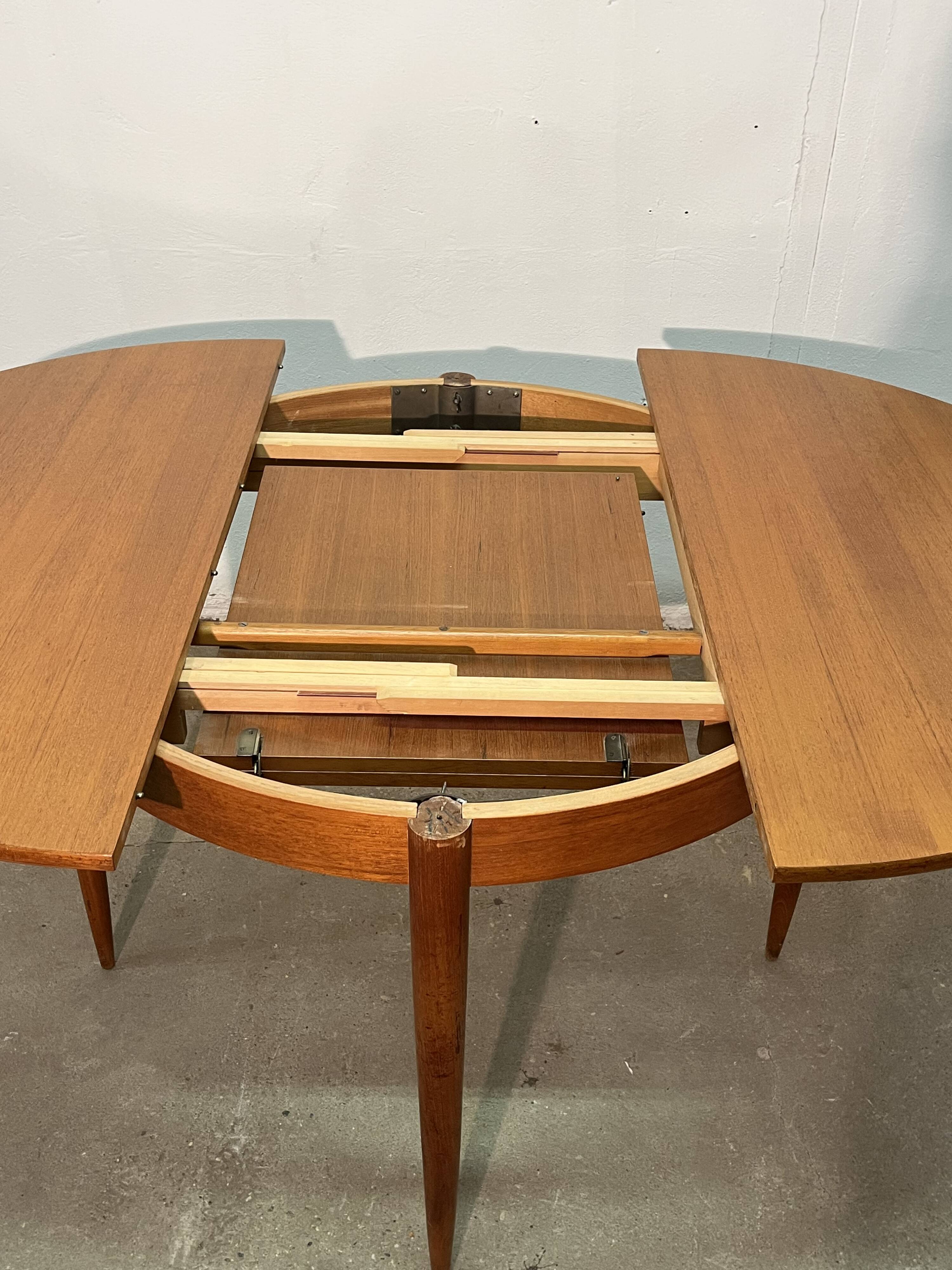 Vintage 1960s teak extendable Scandinavian table.
