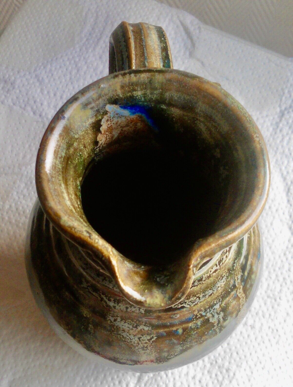 Enamelled ceramic pitcher, signature mb the terminal