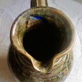 Enamelled ceramic pitcher, signature mb the terminal