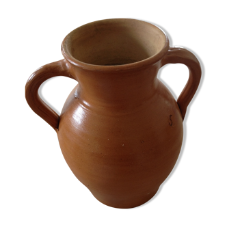 Light-colored glazed stoneware jug