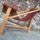 Vintage tripod armchair, designer seating furniture