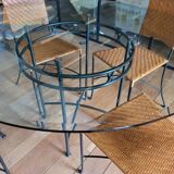 Glass and metal table and its 4 wicker chairs and glass Roche Bobois