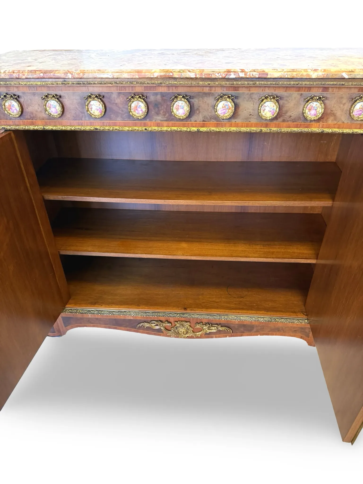 An antique French Louis XVI-style marble-top side cabinet