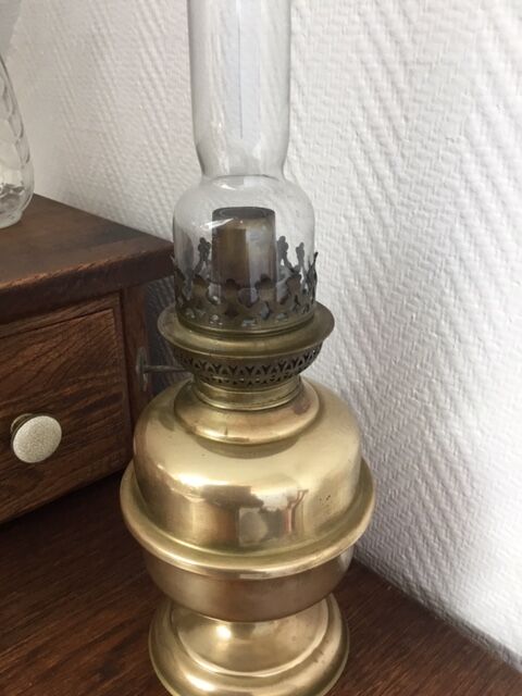 Old-fashioned brass standing oil lamp