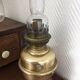 Old-fashioned brass standing oil lamp