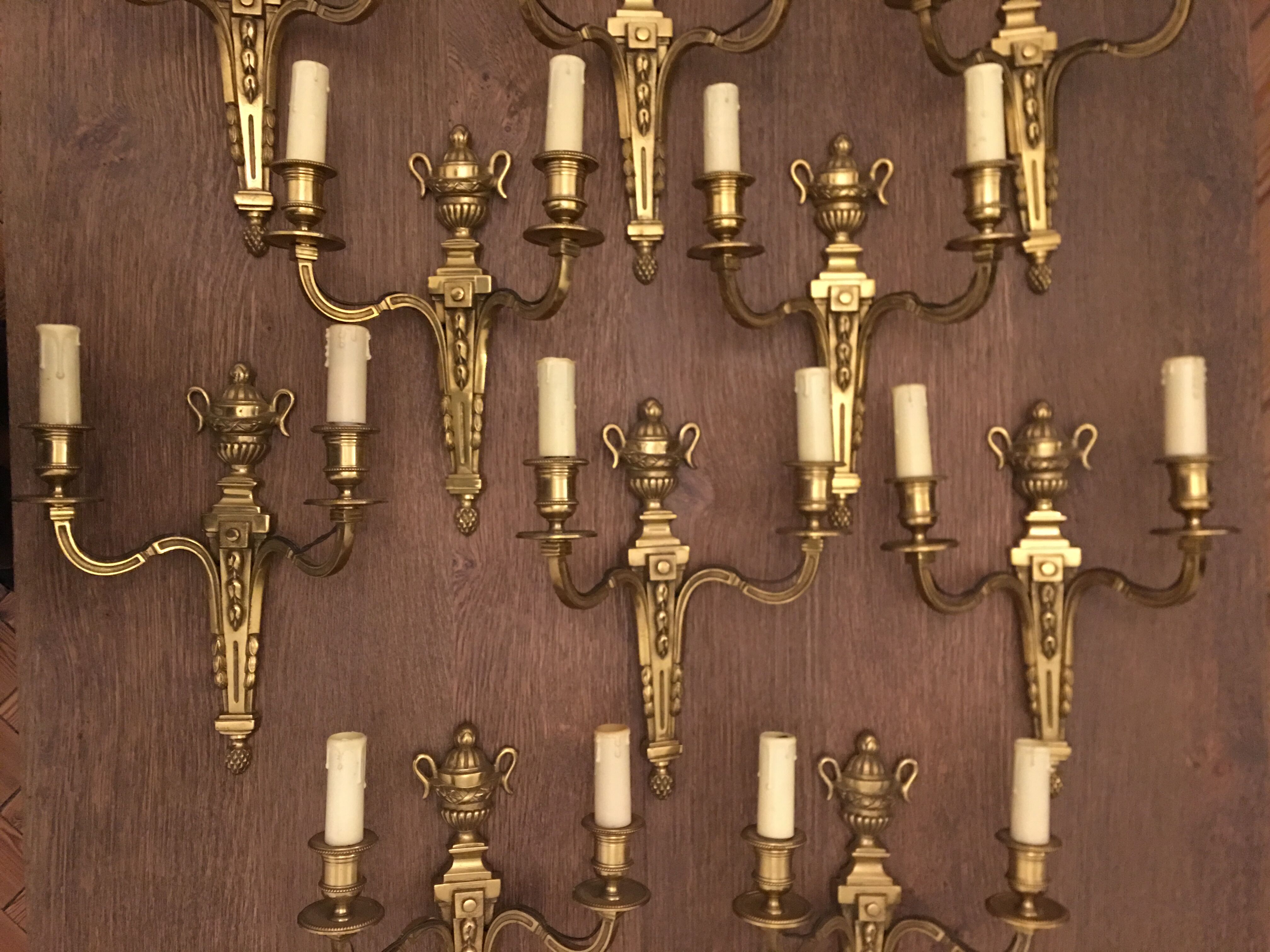 Eleven gilded bronze wall lamps