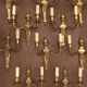 Eleven gilded bronze wall lamps