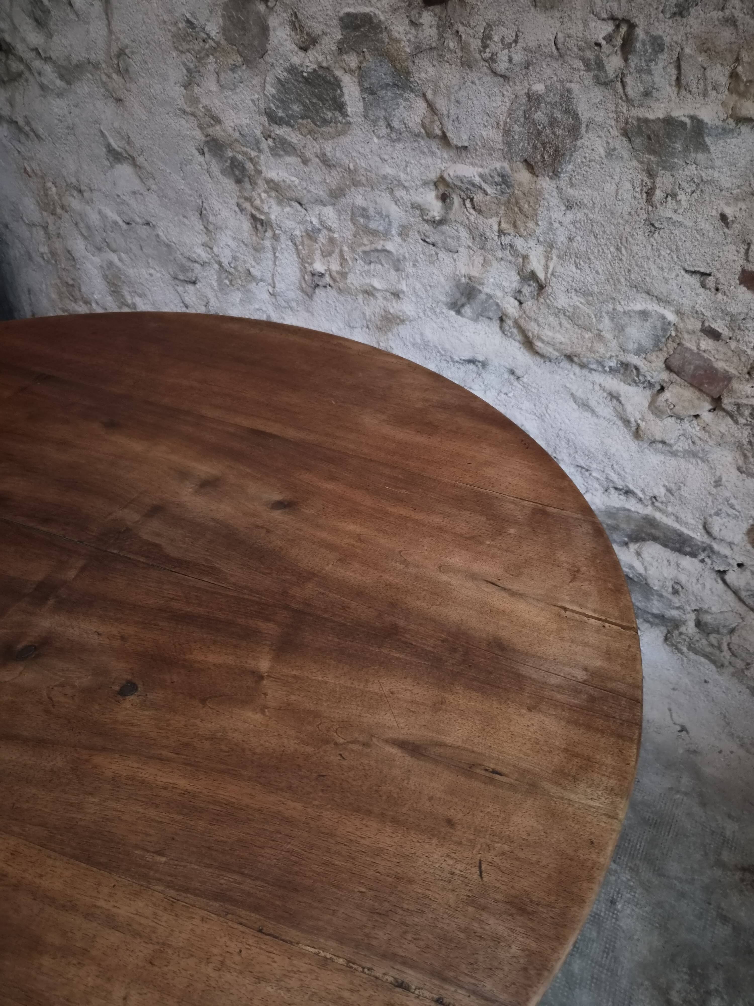 French antique round dining table in walnut, circa 1880–1900.