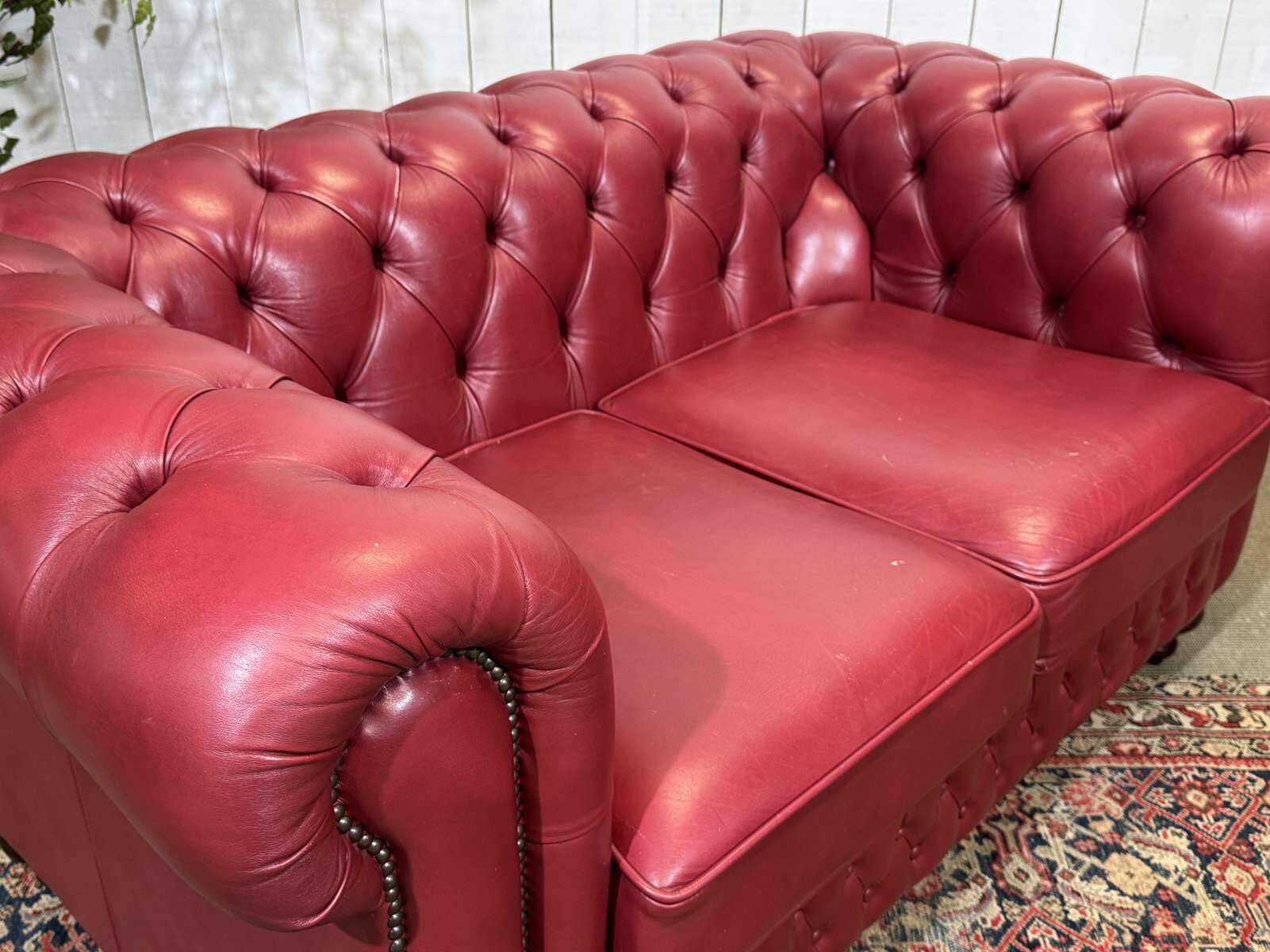 Chesterfield 2-seater leather sofa, modern production from the 2000s.