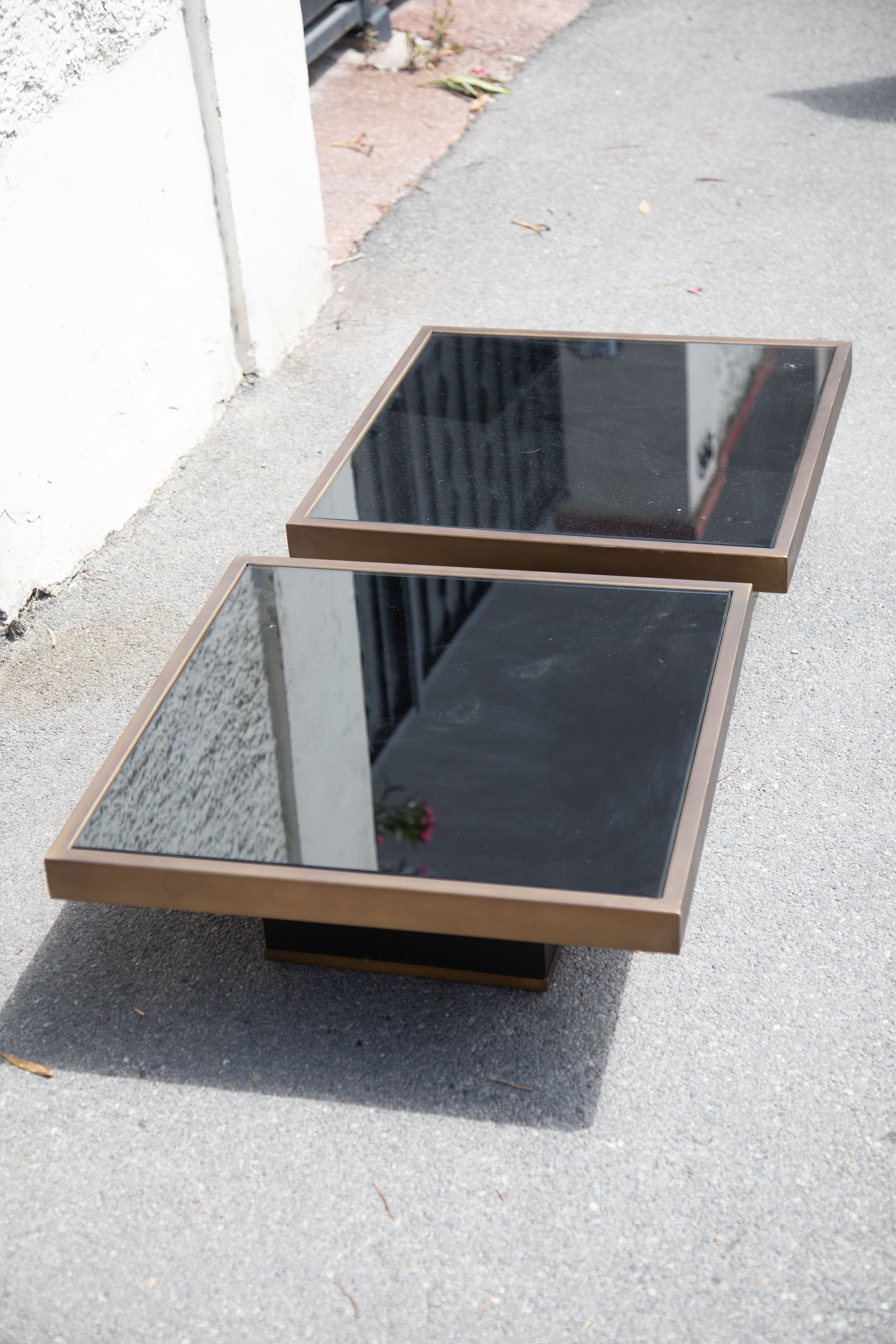 Pair of coffee tables brass black glass
