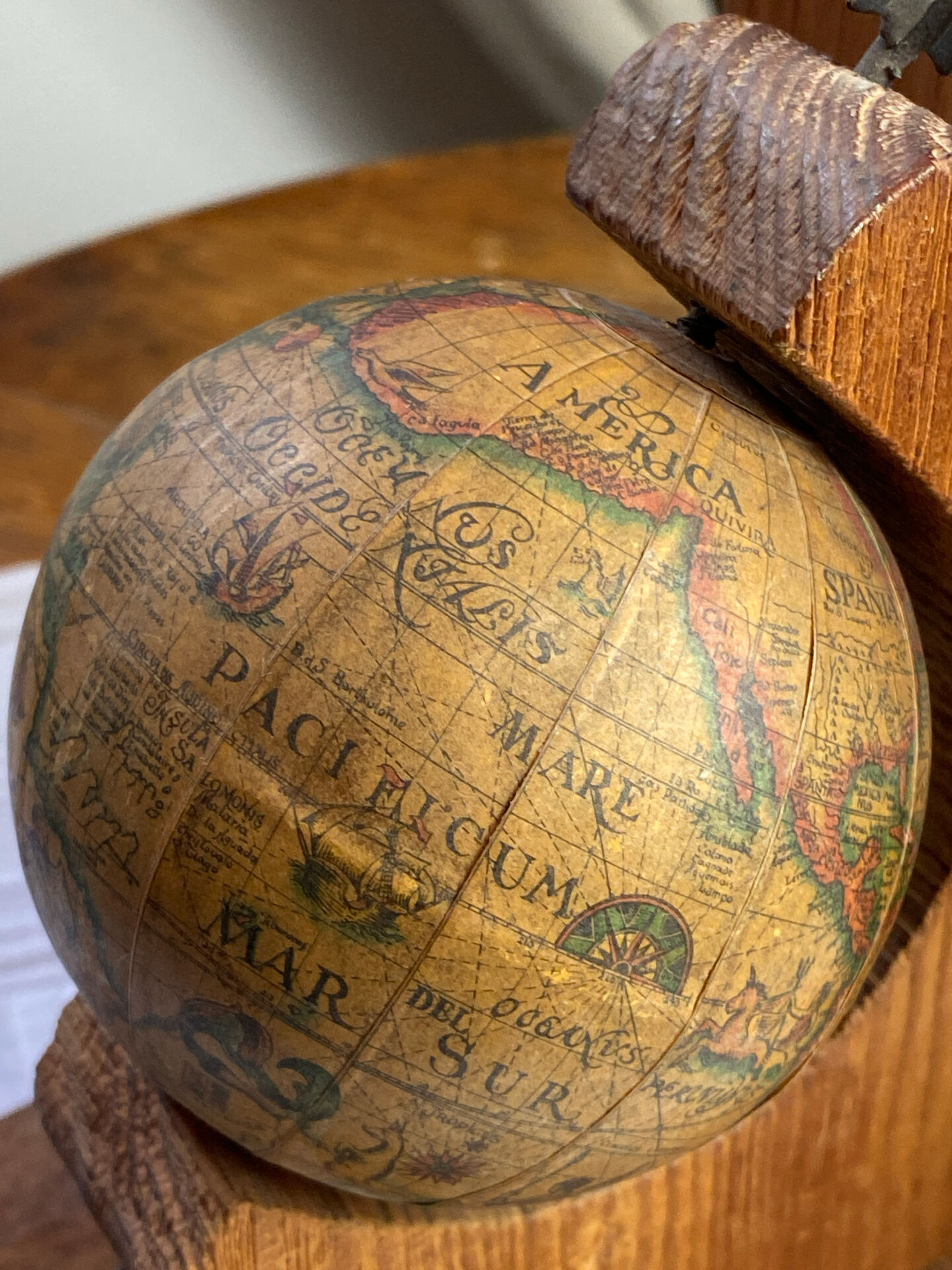 Pair of wooden bookends, rotating globes