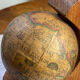 Pair of wooden bookends, rotating globes