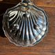 Vintage silver-plated shell butter dish with transparent bowl.
