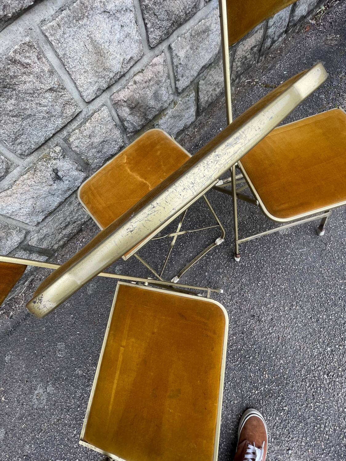 Three folding opera chairs in old gold velvet and brass structure