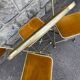 Three folding opera chairs in old gold velvet and brass structure