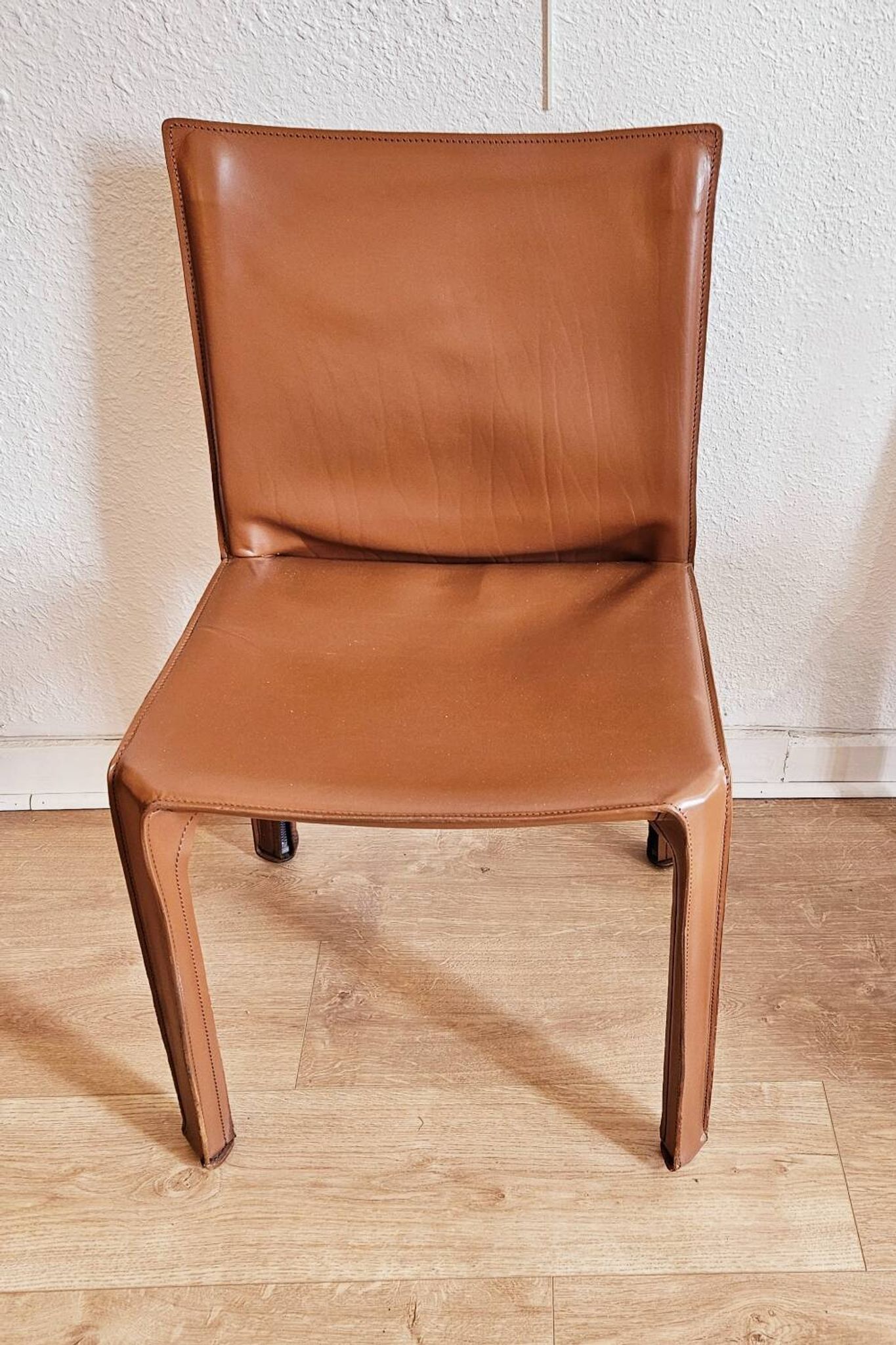 Brown leather zipped chair in Bellini style, Italian design.