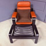 Vintage 1970s armchair with ottoman, leather and wood